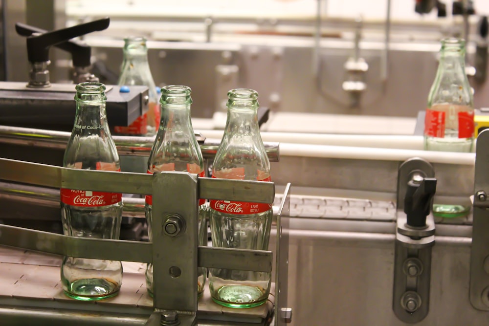 coca cola bottles on table