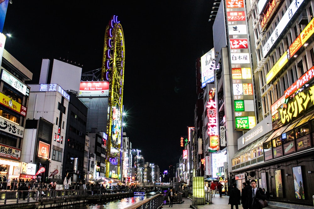 people walking on street during nighttime