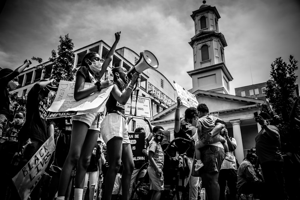 grayscale photo of people in street