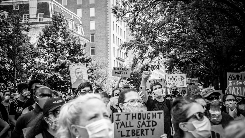 grayscale photo of people walking on street