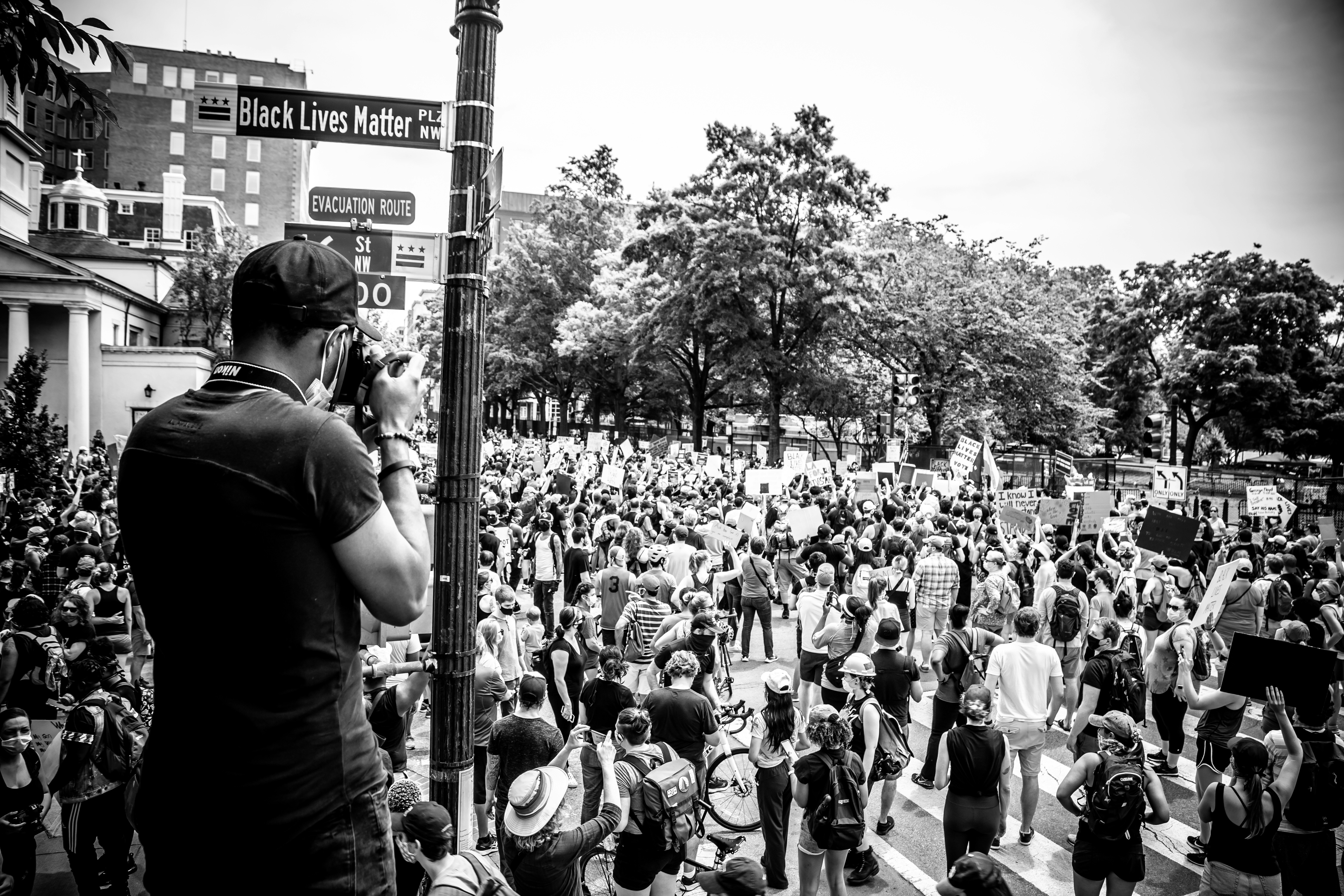 grayscale photo of people walking on street