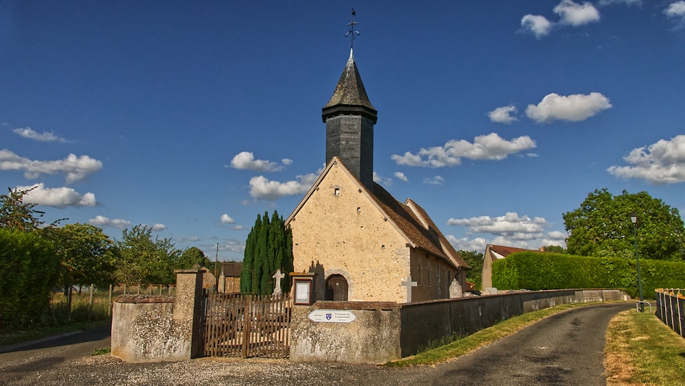 brown and gray concrete church under blue sky during daytime