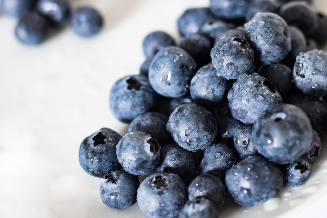 blue berries on white table