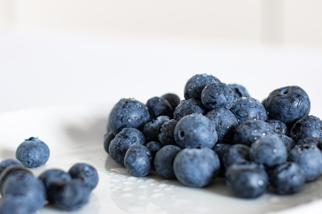 blue berries on white ceramic plate