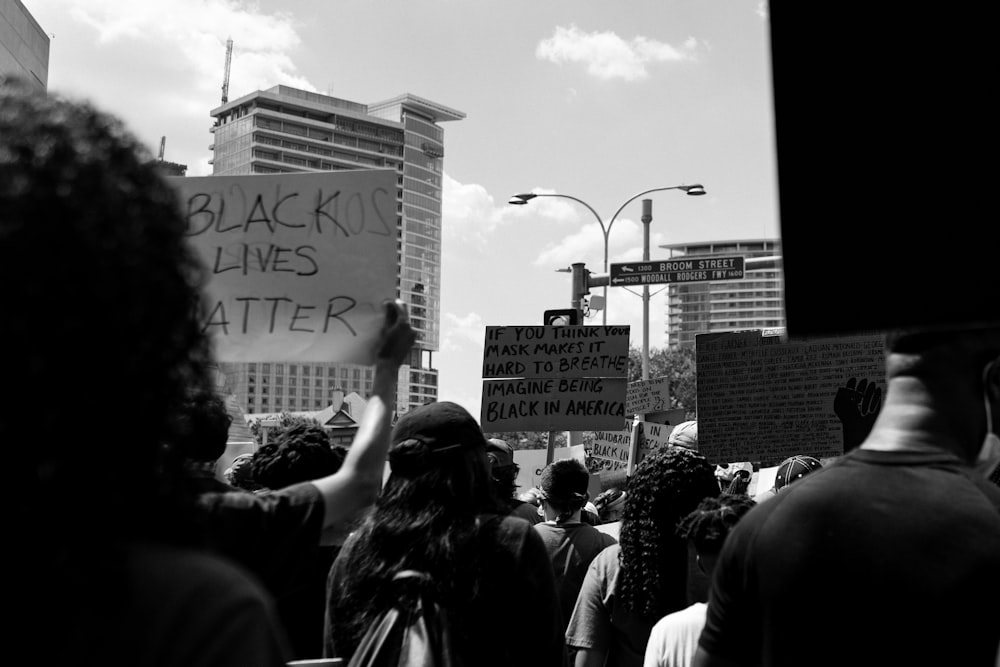 grayscale photo of people walking on street