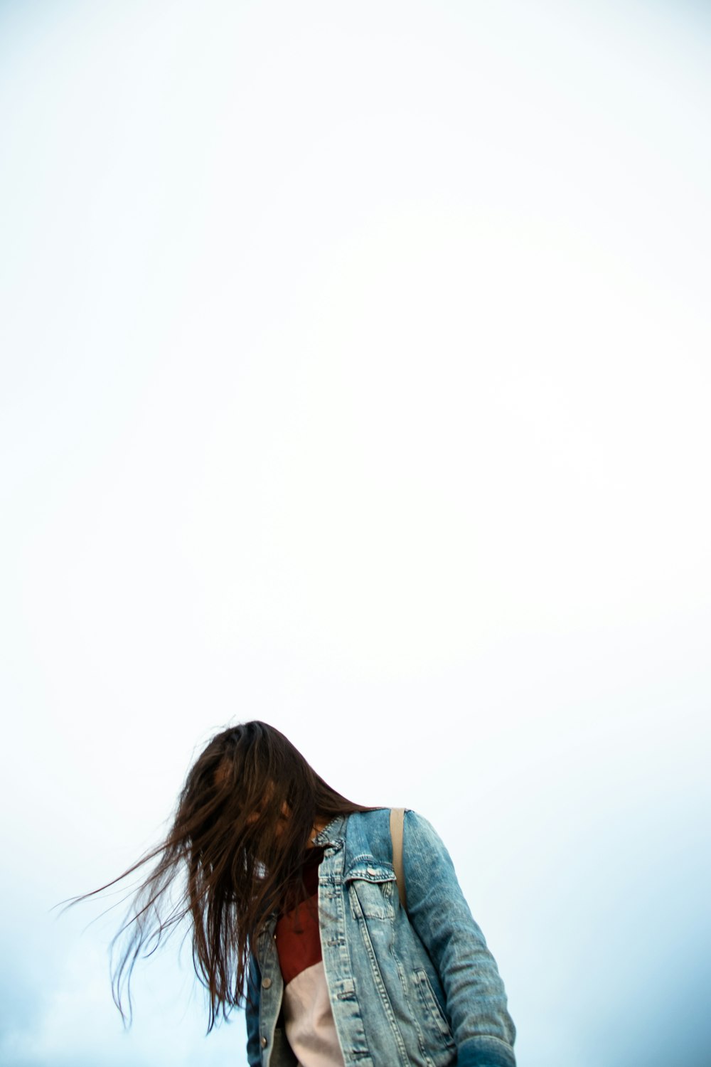 woman in blue and white floral shirt