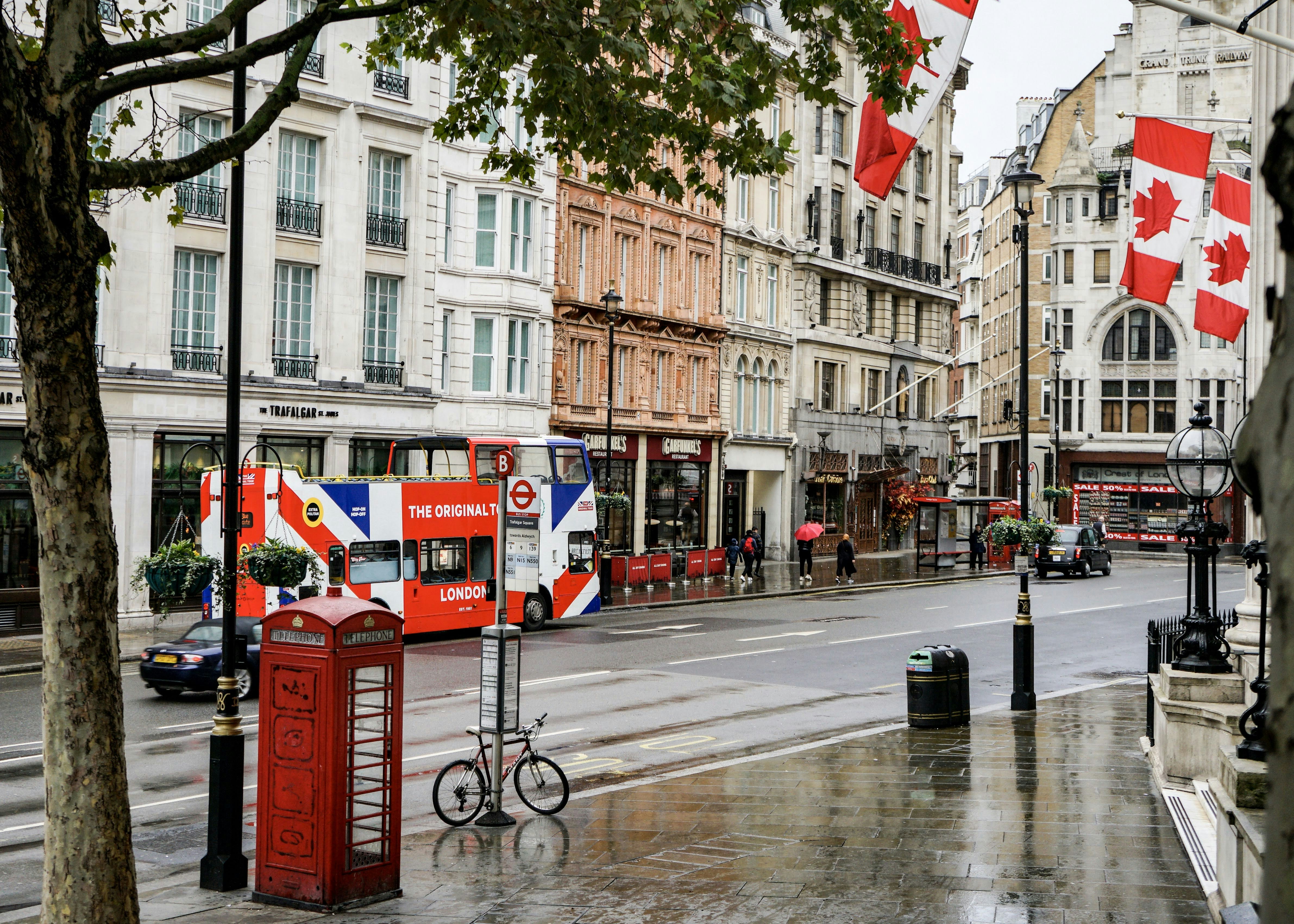 black bicycle parked on sidewalk near building during daytime