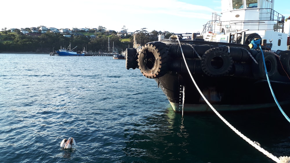 black ship on sea during daytime