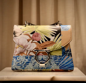 blue and brown floral leather handbag