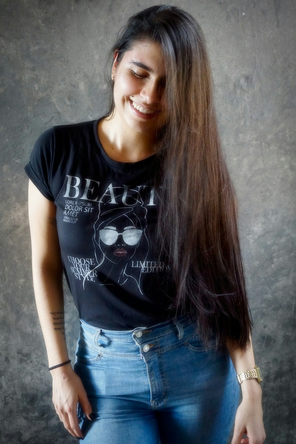 woman in black crew neck t-shirt and blue denim jeans