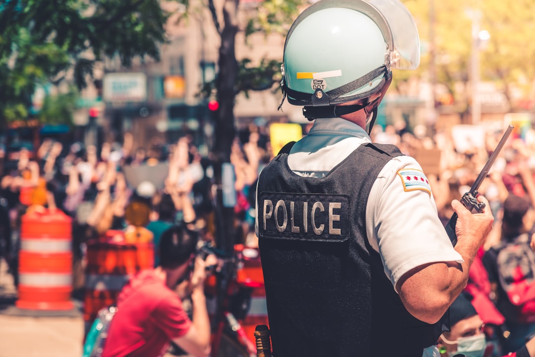 man in black and white helmet and black vest