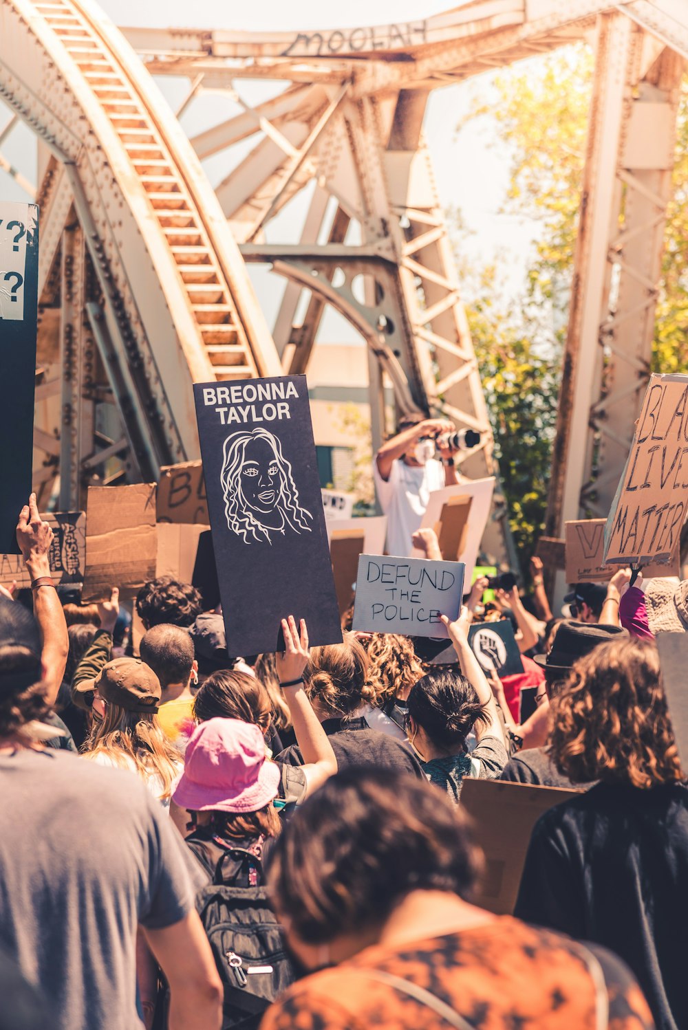 people holding signage during daytime