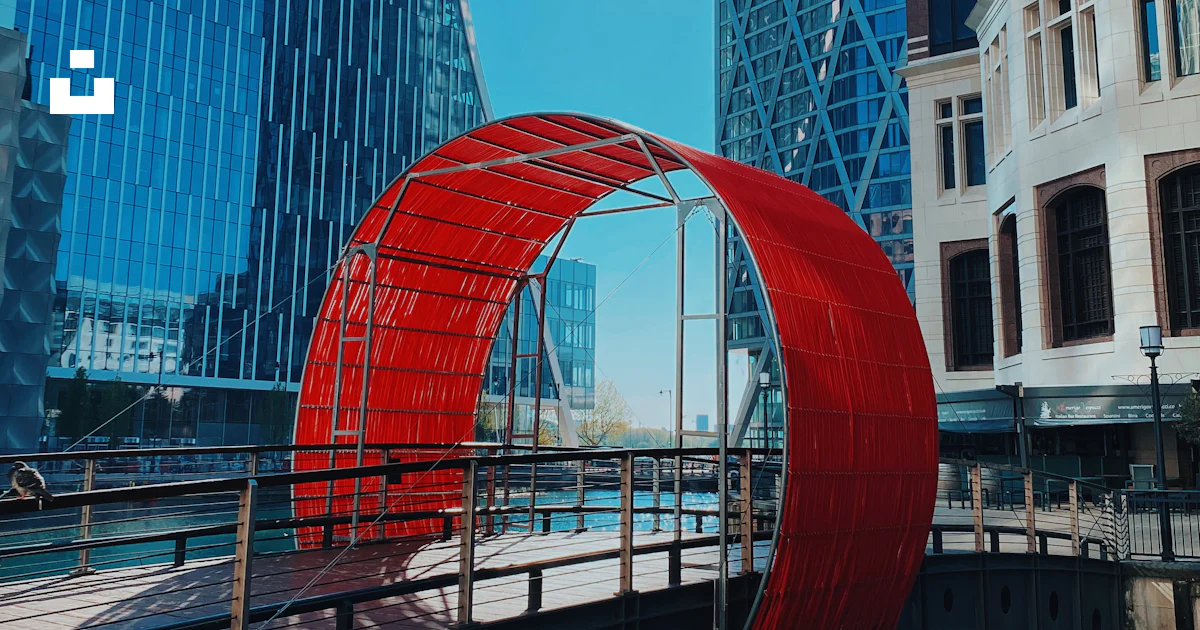 High Rise Arches Red arch near high rise building during daytime photo – Free Building ...