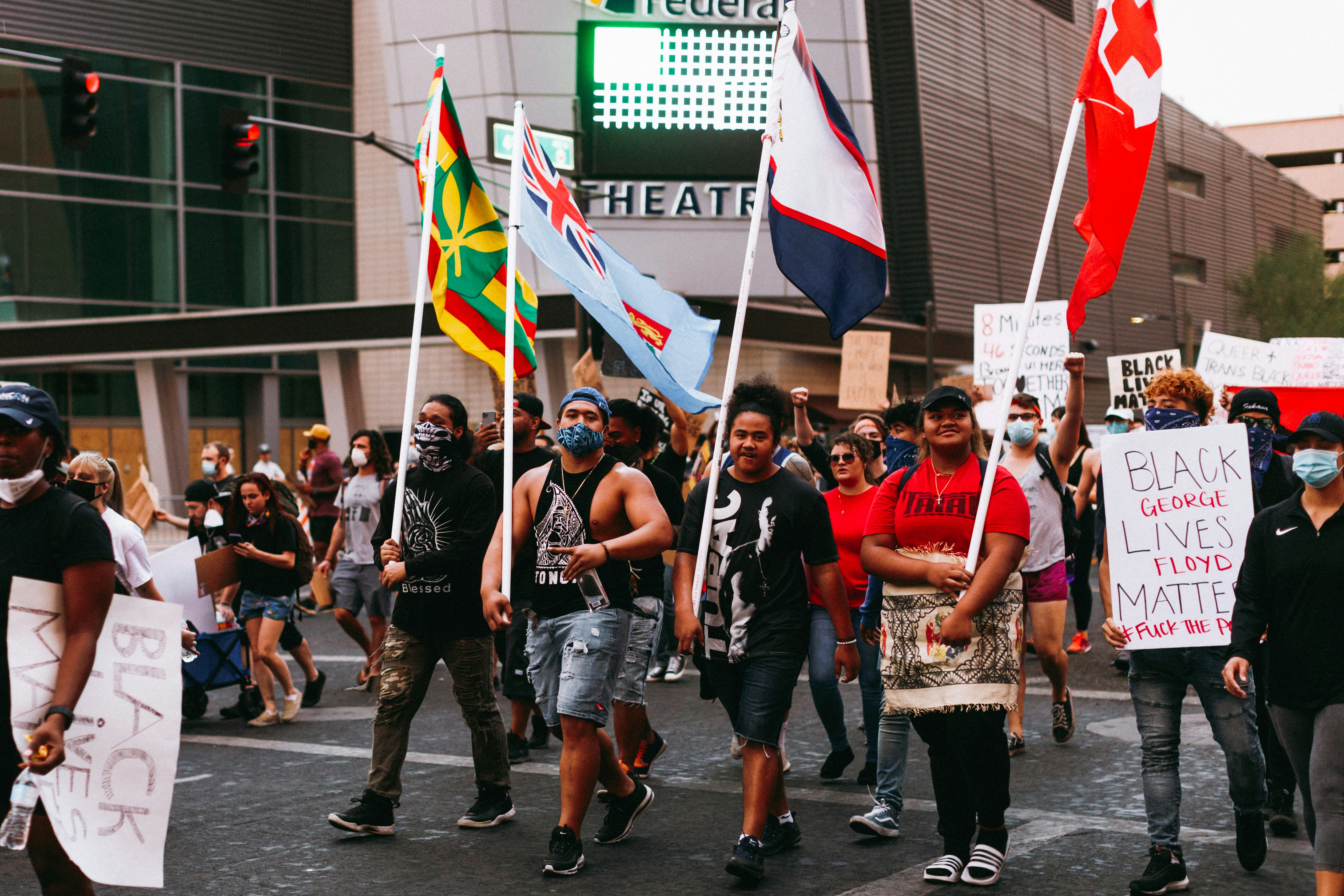 people standing on road during daytime