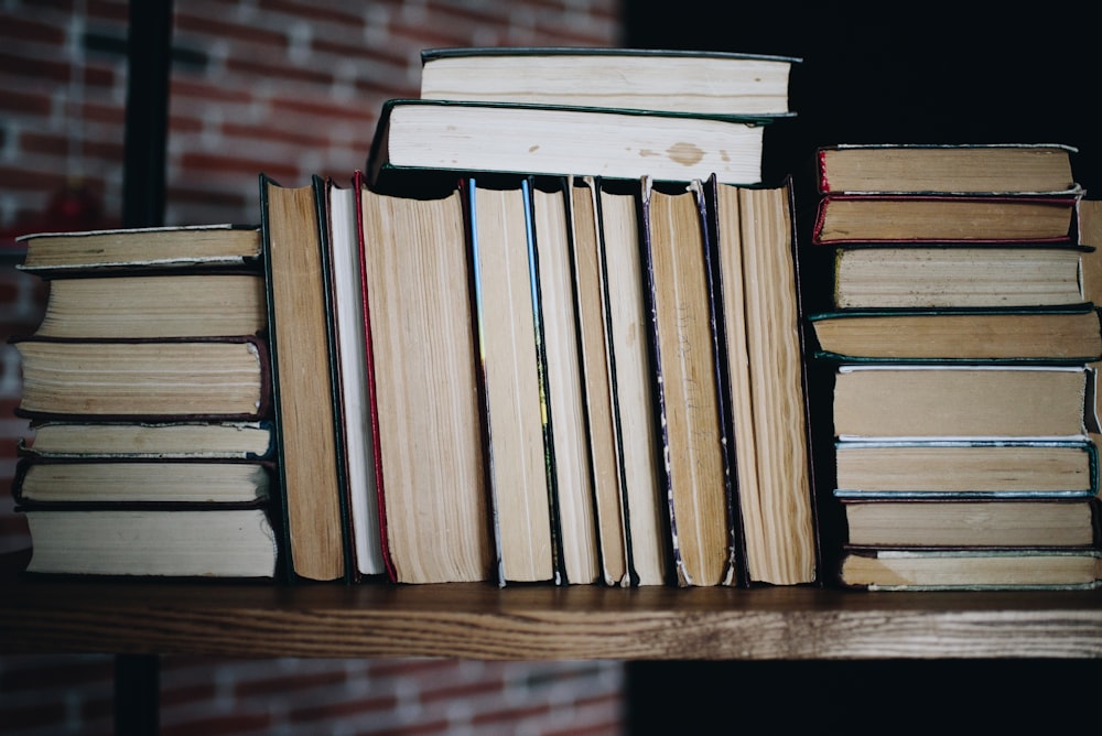 brown wooden books on brown wooden table