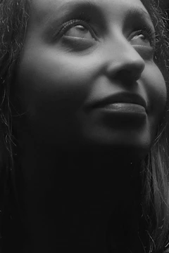Woman practicing face yoga with a serene expression