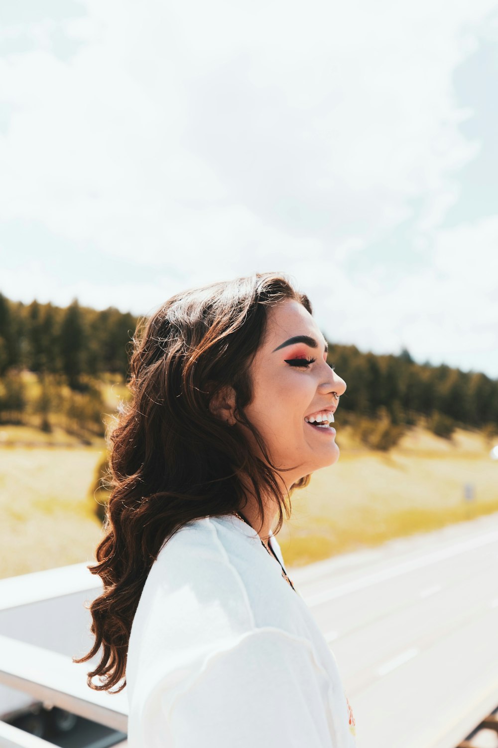 woman in white shirt smiling