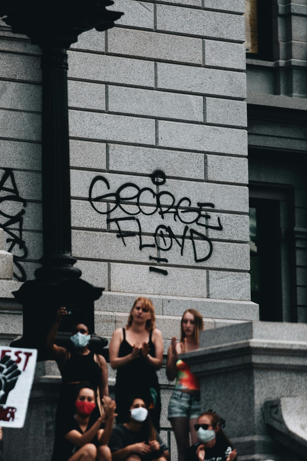 3 women sitting on stairs