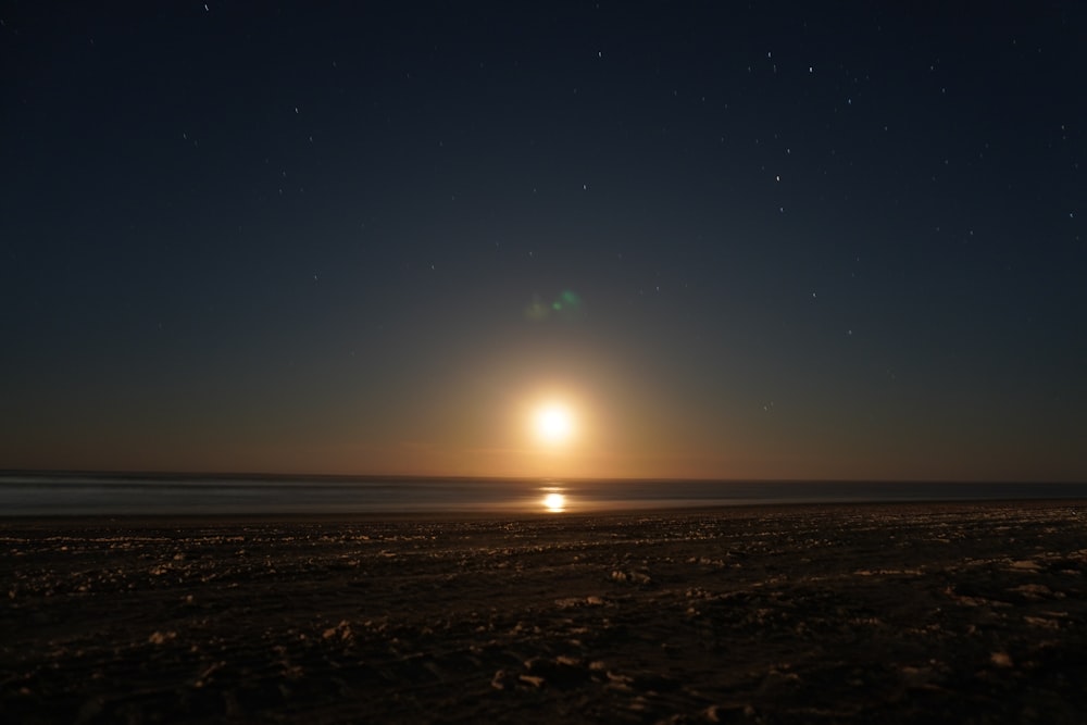 sun setting over the beach