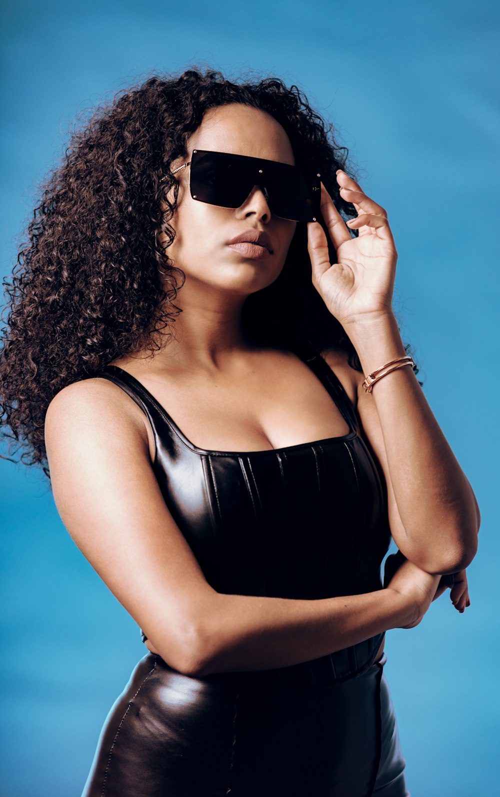 woman in black tank top wearing black sunglasses