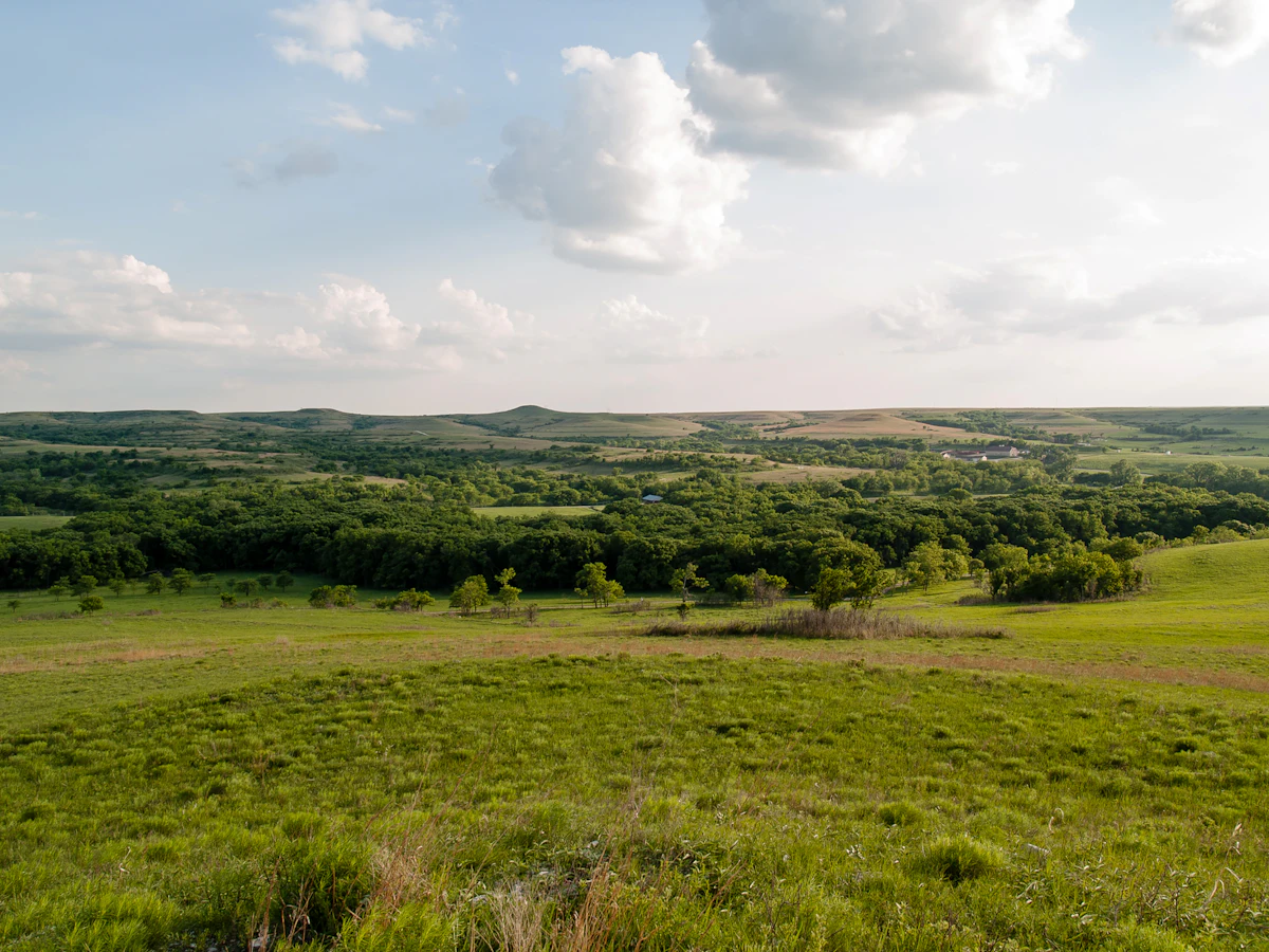 A spring view over green prairie and wooded creeks on the Konza Prairie in Kansas