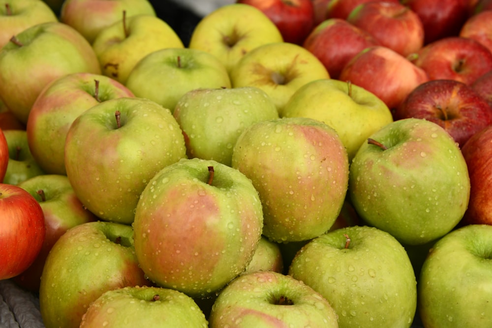 green and red apples on display