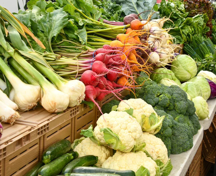 Cauliflower, broccoli, radishes and onions on a market stall
