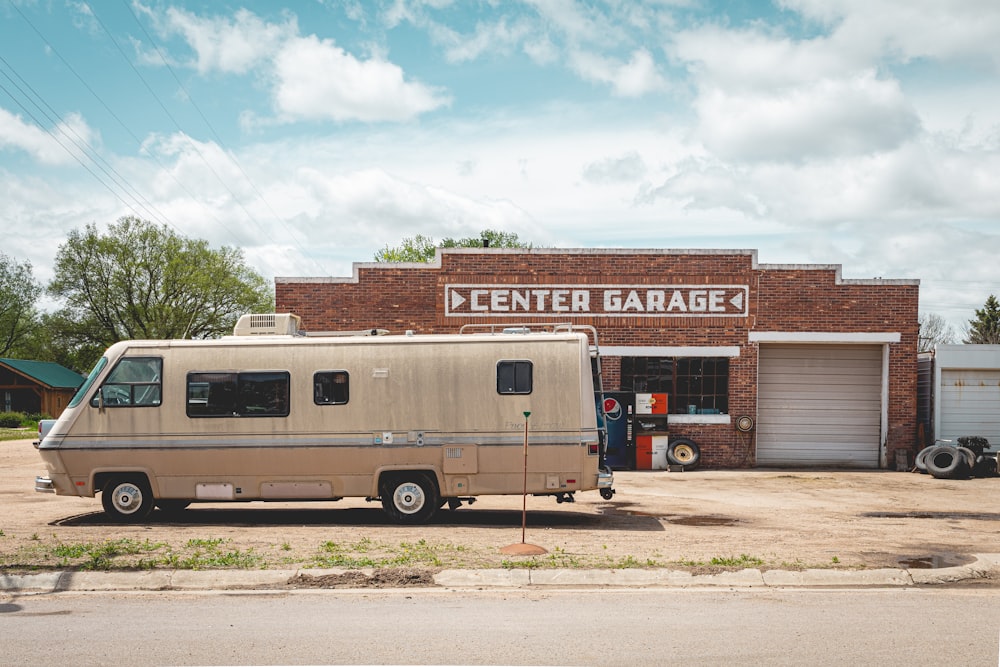 a van parked in front of a garage