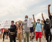 A group of diverse citizens attending a local meeting about government accountability.