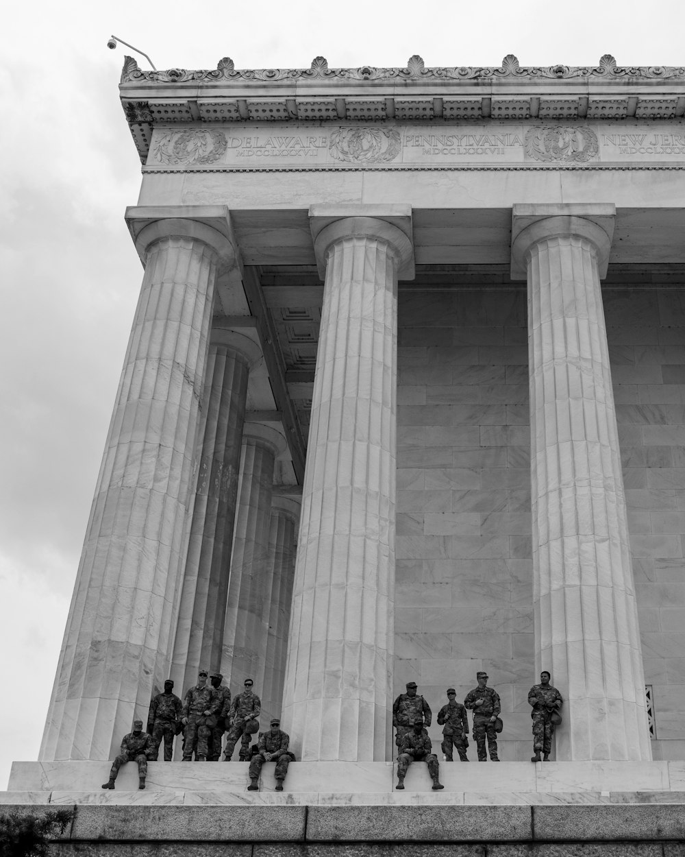 people walking on gray concrete building