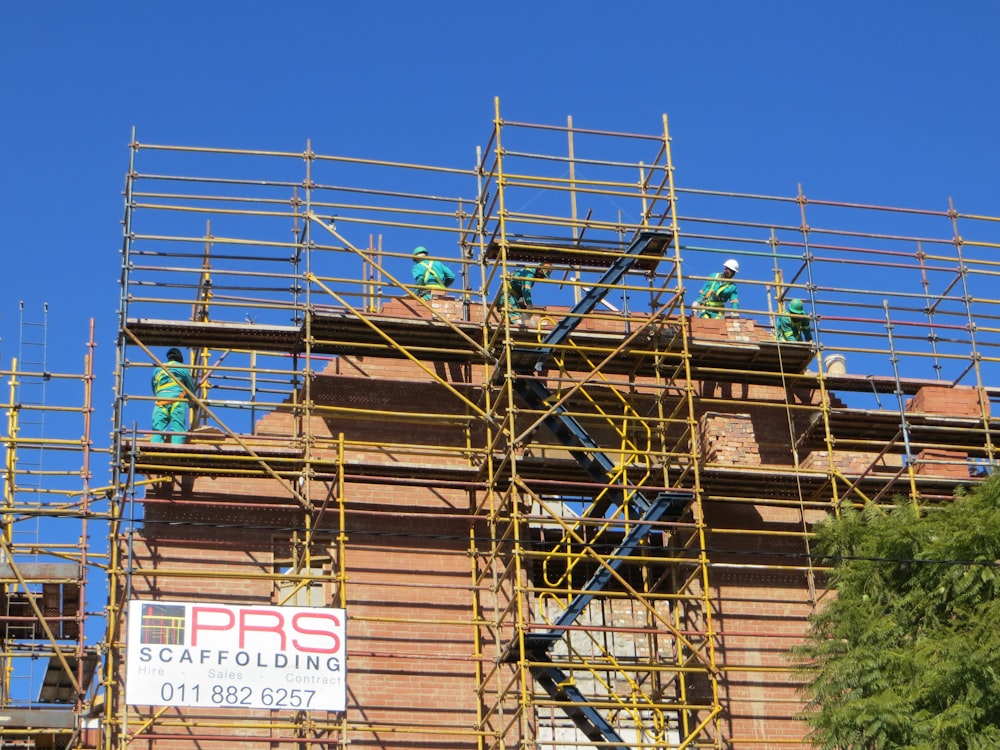 brown brick building under blue sky during daytime