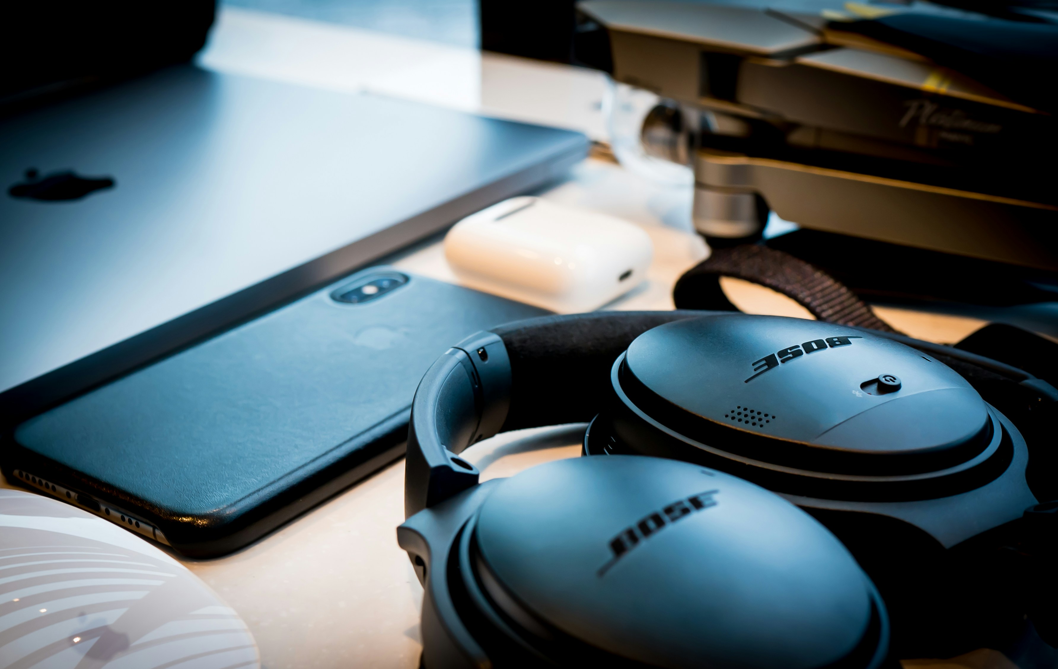 black sony headphones beside black laptop computer