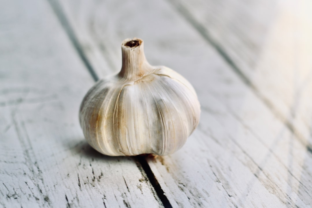 garlic on gray wooden table