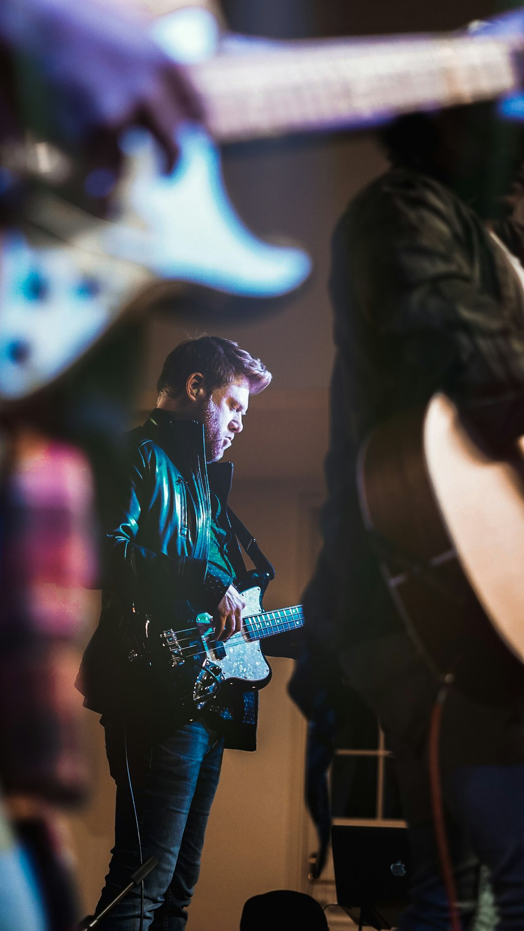 man playing guitar on stage