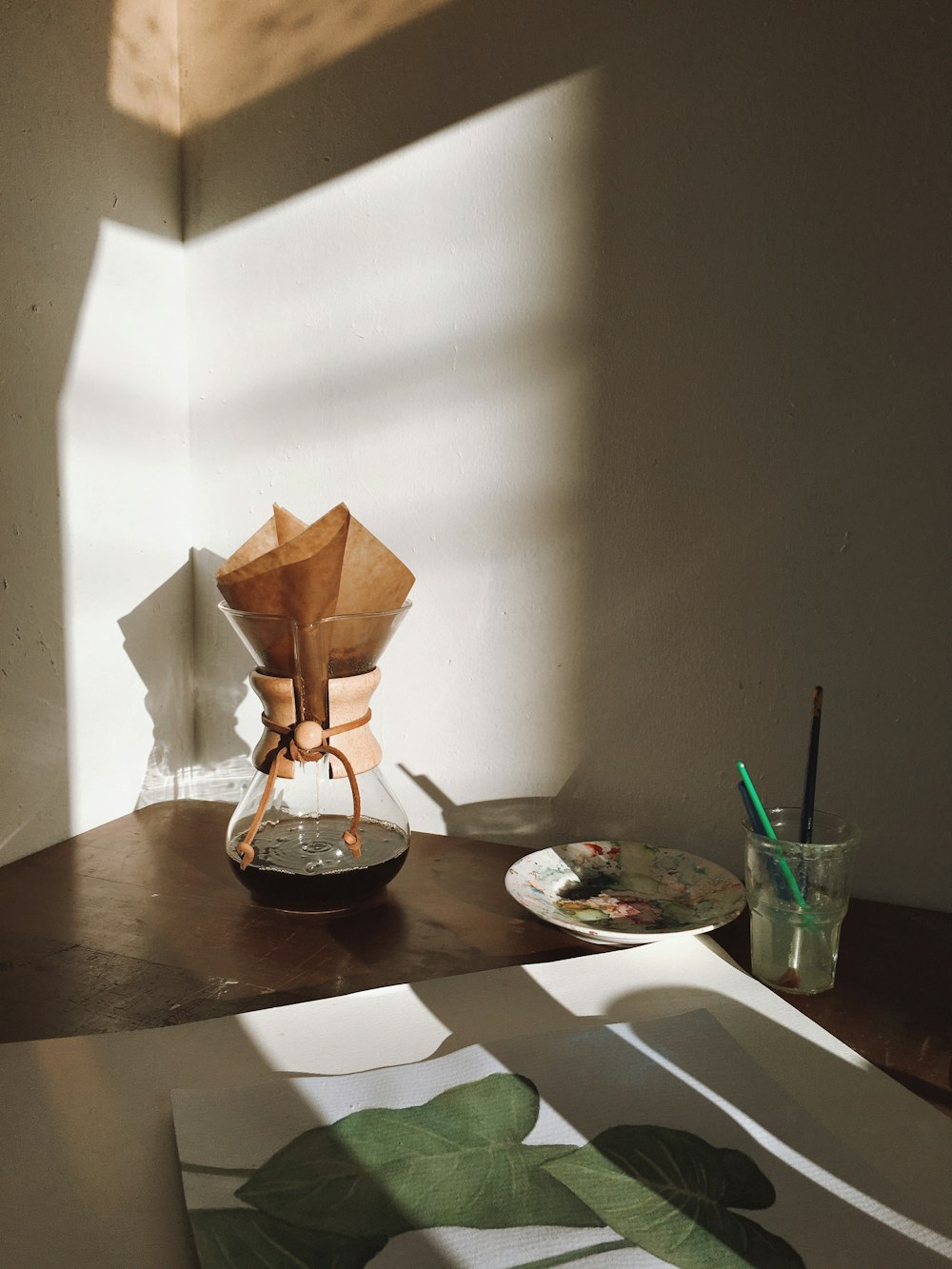 brown paper boat on brown wooden table