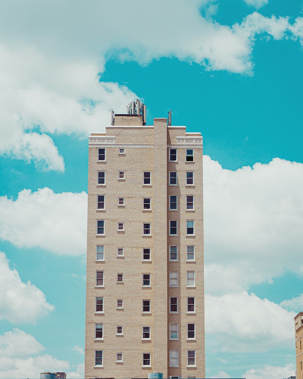 brown concrete building under blue sky during daytime