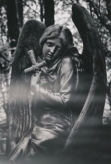 woman in black dress statue