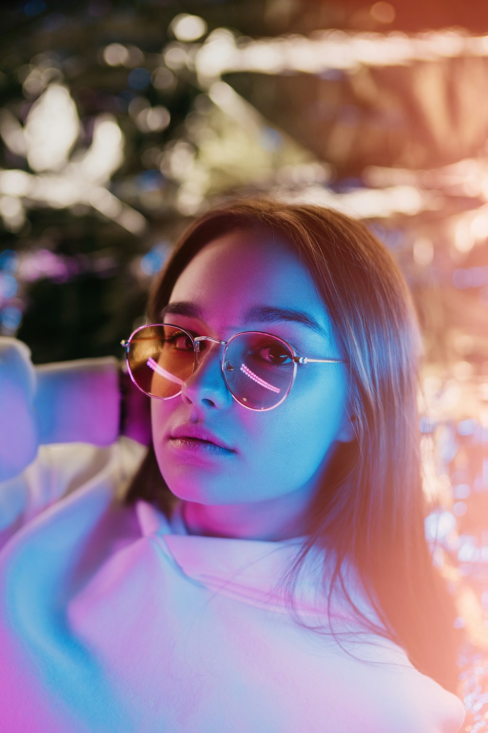 woman in pink shirt wearing eyeglasses