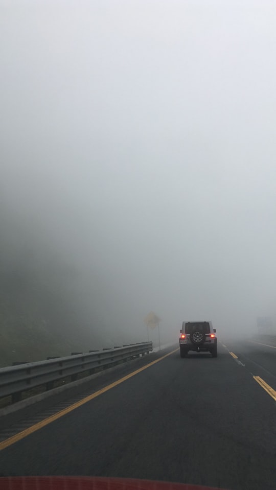 black suv on road during foggy weather in Maltrata Mexico