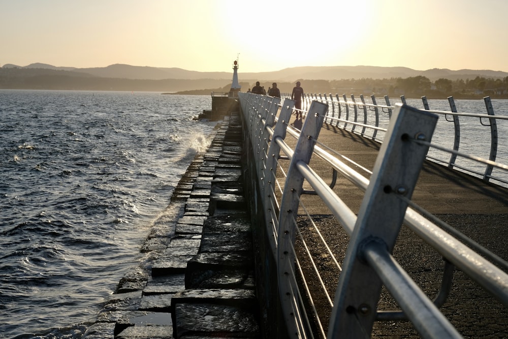 gray wooden dock on sea during daytime