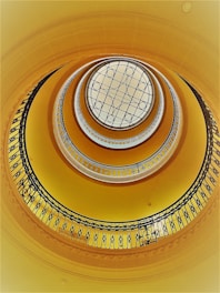 brown spiral staircase with white ceiling