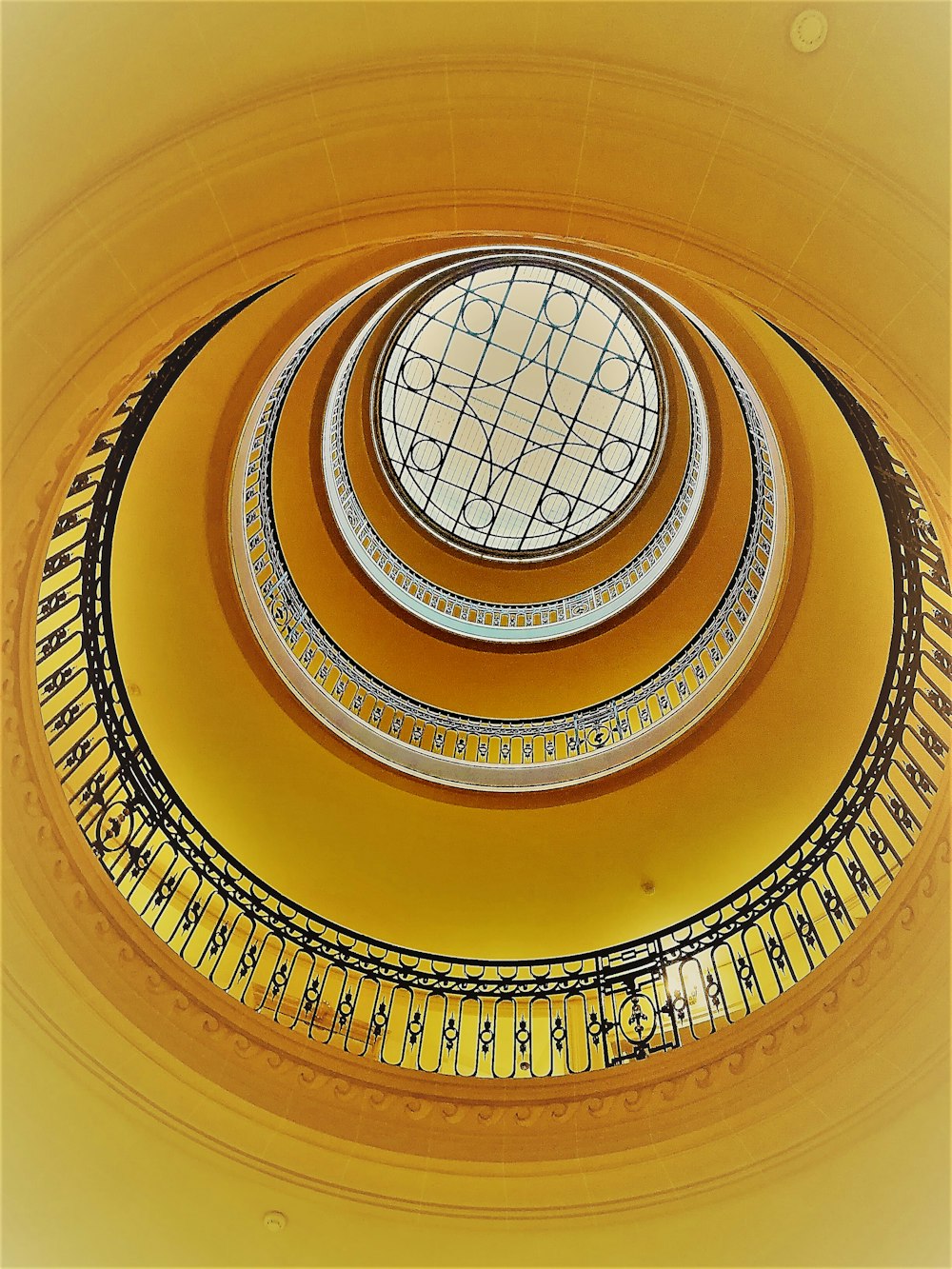 brown spiral staircase with white ceiling