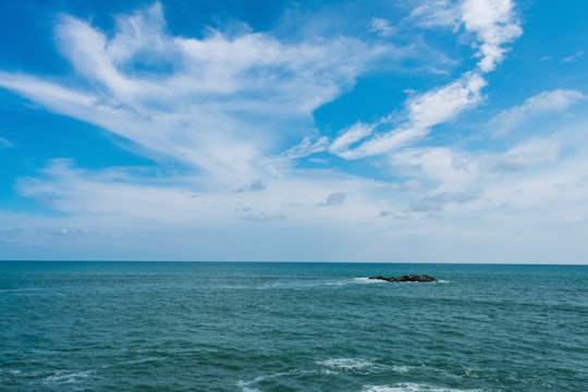 blue sea under blue sky and white clouds during daytime in Kanyakumari India