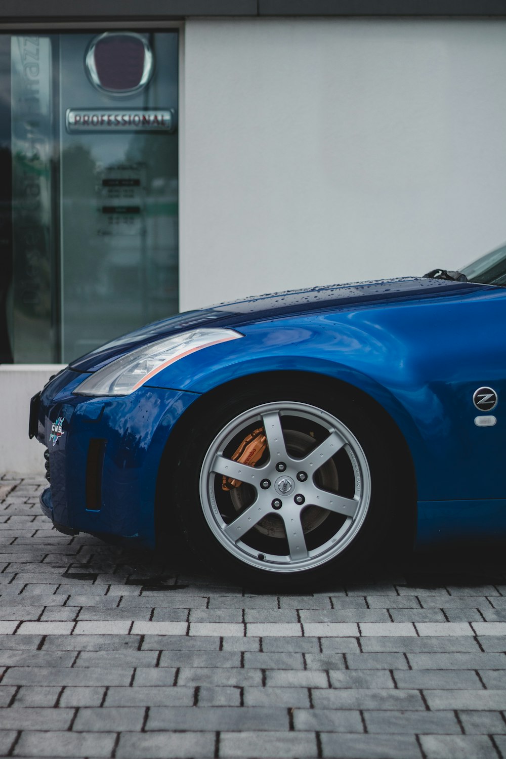 blue car with gray wheel