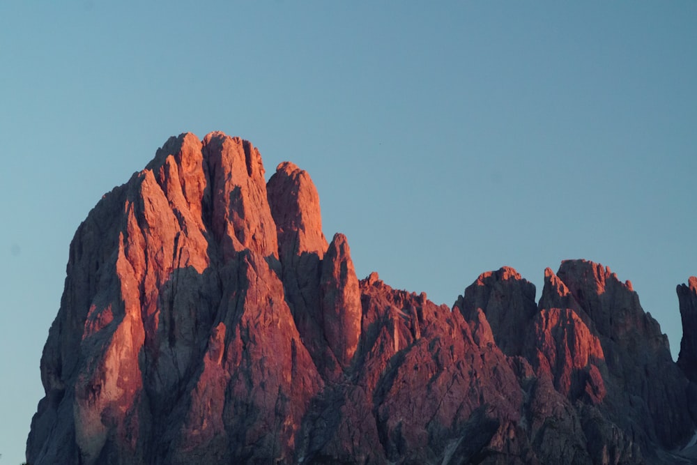 brown rocky mountain under blue sky during daytime