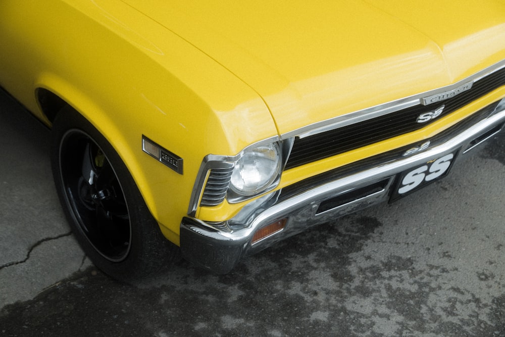 yellow car on gray concrete floor