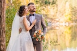 man in gray suit and woman in white wedding dress