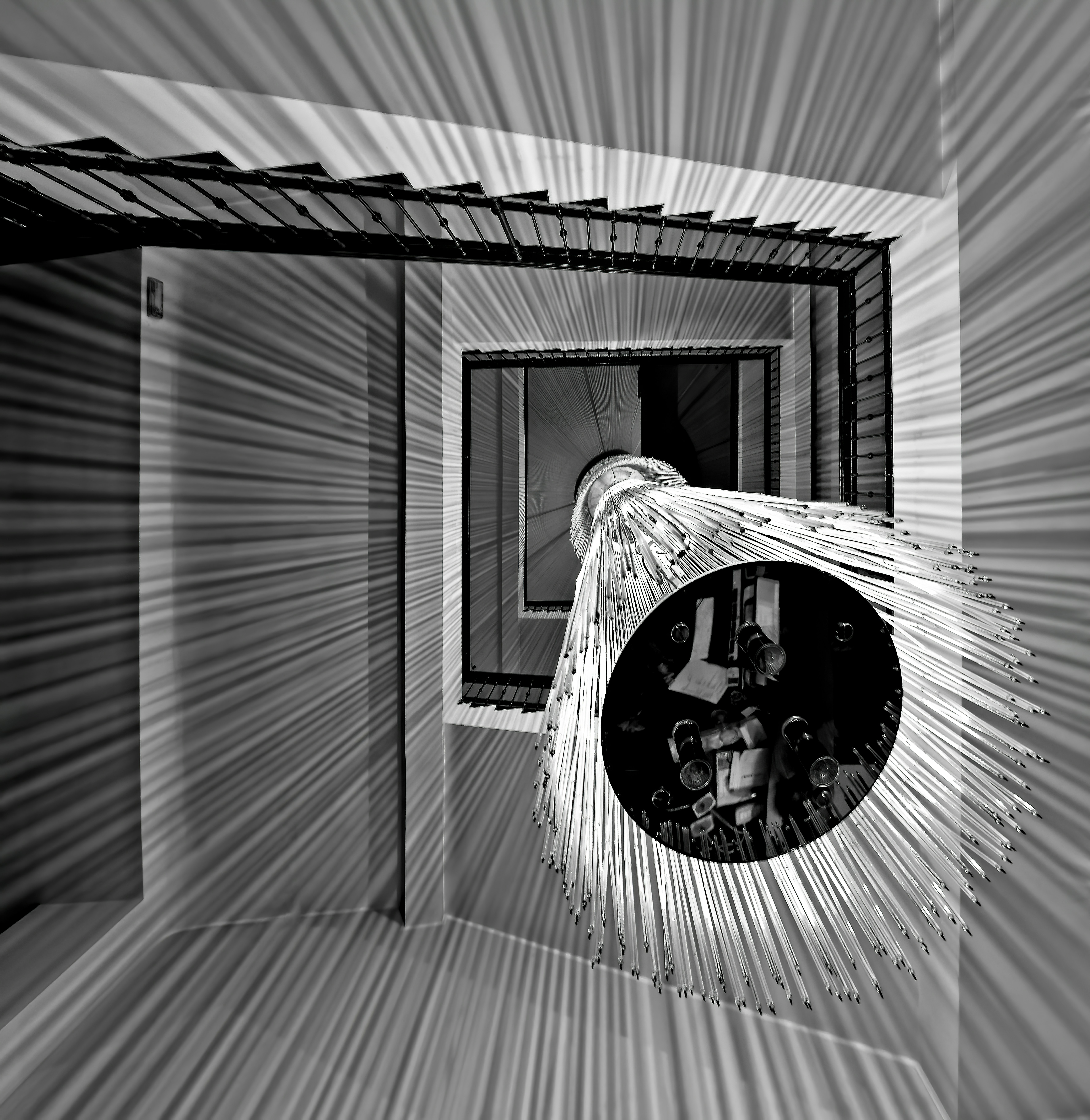 grayscale photo of round mirror