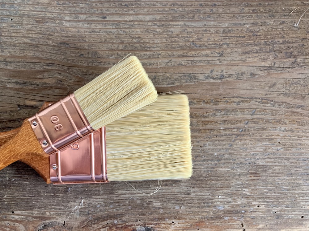 brown wooden handle brush on brown wooden table