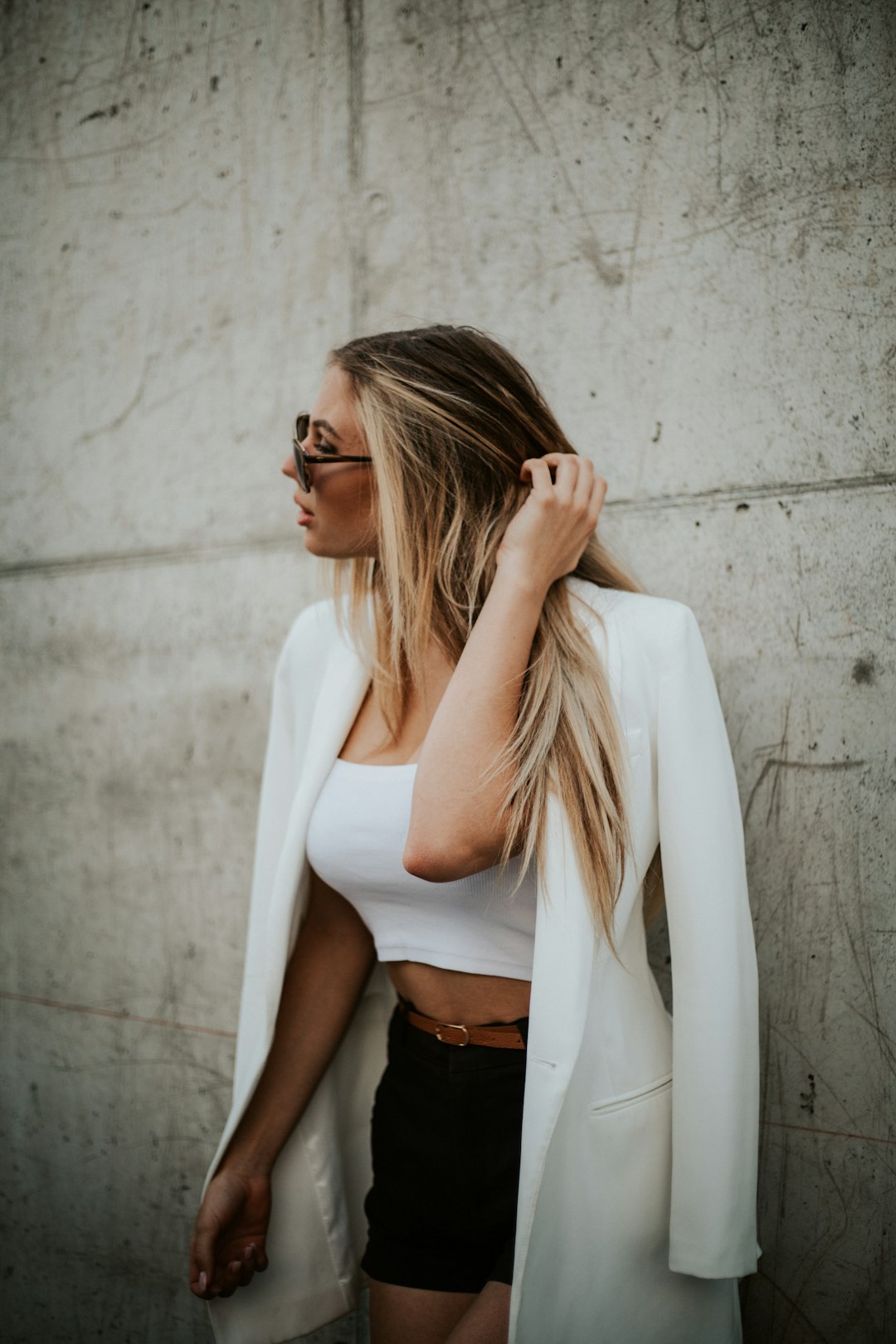 woman in white long sleeve shirt and black skirt